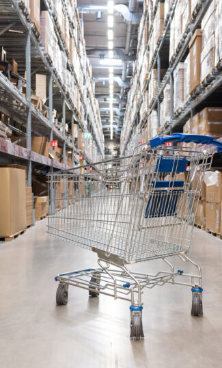 Shopping cart in warehouse aisle